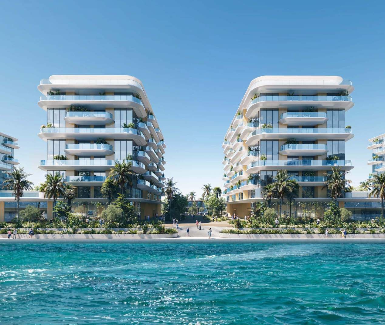 Canal-front apartment buildings at Manchester City Yas Residences, viewed across the Yas Canal